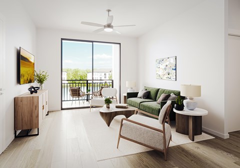 a living room with a green couch and a balcony